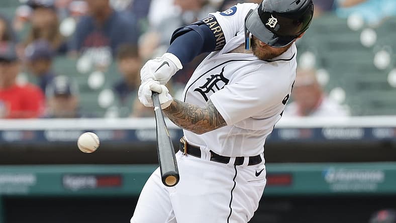 Jul 6, 2022; Detroit, Michigan, USA; Detroit Tigers catcher Tucker Barnhart (15) hits an RBI single during the second inning against the Cleveland Guardians at Comerica Park. Mandatory Credit: Rick Osentoski-USA TODAY Sports