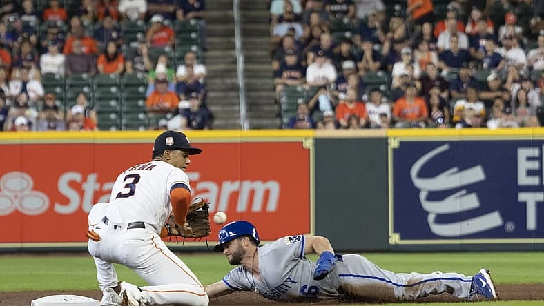 Jul 6, 2022; Houston, Texas, USA; Kansas City Royals left fielder Andrew Benintendi (16) steals second base against Houston Astros shortstop Jeremy Pena (3) in the first inning at Minute Maid Park. Mandatory Credit: Thomas Shea-USA TODAY Sports