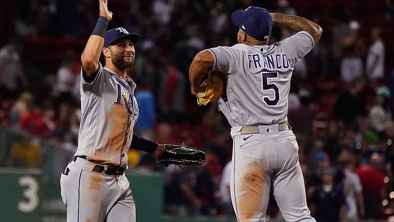 Jul 6, 2022; Boston, Massachusetts, USA; Tampa Bay Rays center fielder Kevin Kiermaier (39), and shortstop Wander Franco (5) react after defeating the Boston Red Sox in nine innings at Fenway Park. Mandatory Credit: David Butler II-USA TODAY Sports
