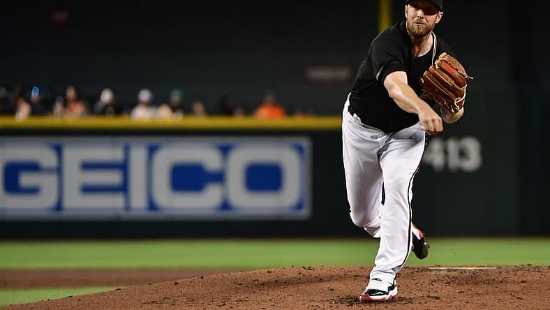 Jul 6, 2022; Phoenix, Arizona, USA; Arizona Diamondbacks starting pitcher Merrill Kelly (29) throws a pitch in the second inning against the San Francisco Giants at Chase Field. Mandatory Credit: Matt Kartozian-USA TODAY Sports