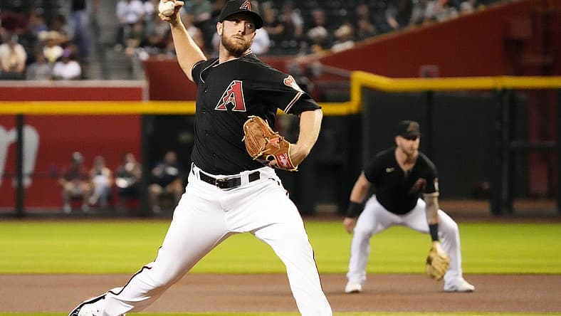 Jul 6, 2022; Phoenix, Arizona, USA; Arizona Diamondbacks starting pitcher Merrill Kelly (29) throws to the San Francisco Giants in the first inning at Chase Field. Mandatory Credit: Rob Schumacher-Arizona Republic
Mlb San Franicsco Giants At Arizona Diamondbacks