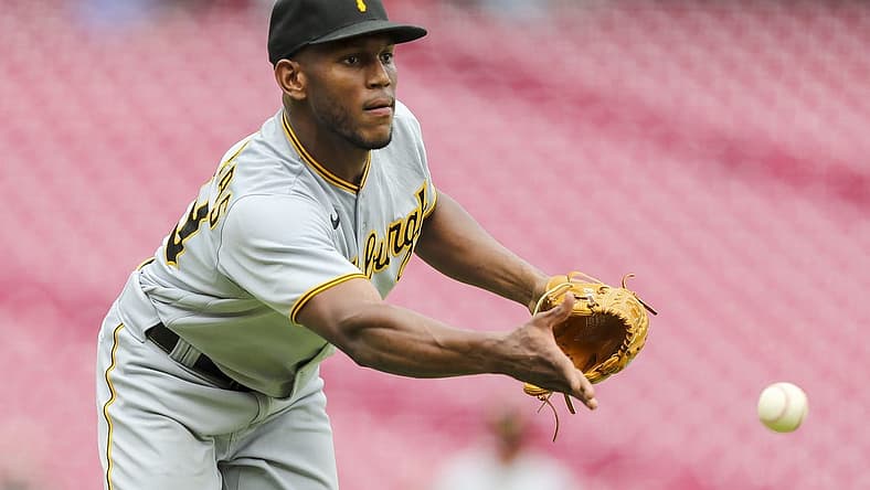 Jul 7, 2022; Cincinnati, Ohio, USA; Pittsburgh Pirates starting pitcher Roansy Contreras (59) throws to first to get Cincinnati Reds second baseman Jonathan India (not pictured) out in the first inning at Great American Ball Park. Mandatory Credit: Katie Stratman-USA TODAY Sports