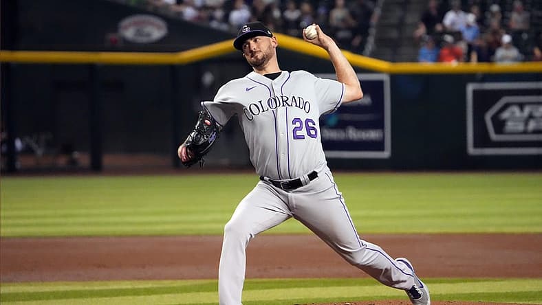 Jul 7, 2022; Phoenix, Arizona, USA; Colorado Rockies starting pitcher Austin Gomber (26) pitches against the Arizona Diamondbacks during the first inning at Chase Field. Mandatory Credit: Joe Camporeale-USA TODAY Sports