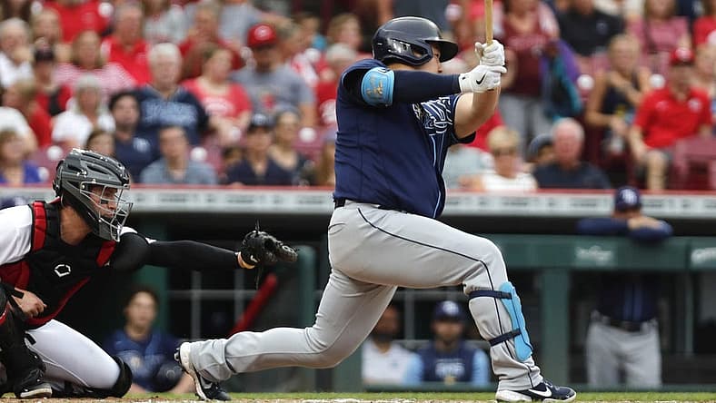 Jul 8, 2022; Cincinnati, Ohio, USA; Tampa Bay Rays first baseman Ji-Man Choi (26) hits an RBI single against the Cincinnati Reds during the third inning at Great American Ball Park. Mandatory Credit: David Kohl-USA TODAY Sports