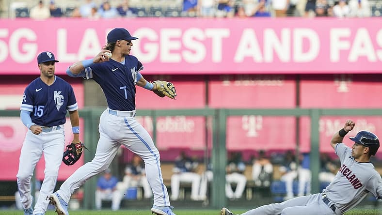 Jul 8, 2022; Kansas City, Missouri, USA; Kansas City Royals shortstop Bobby Witt Jr. (7) throws to first base after forcing out Cleveland Guardians left fielder Steven Kwan (38) during the first inning at Kauffman Stadium. Mandatory Credit: Jay Biggerstaff-USA TODAY Sports