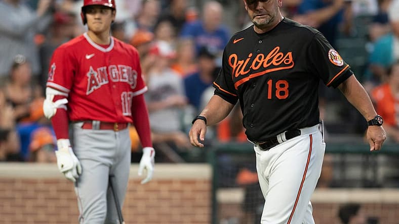 Jul 8, 2022; Baltimore, Maryland, USA; Baltimore Orioles manager Brandon Hyde (18) walks off the field before Los Angeles Angels center fielder Mike Trout (27) third inning at bat at Oriole Park at Camden Yards. Mandatory Credit: Tommy Gilligan-USA TODAY Sports