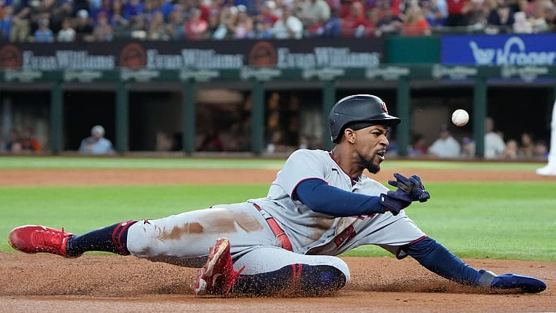 Jul 8, 2022; Arlington, Texas, USA; Minnesota Twins center fielder Byron Buxton (25) steals third base against the Texas Rangers during the third inning at Globe Life Field. Mandatory Credit: Jim Cowsert-USA TODAY Sports