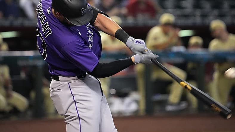 Jul 8, 2022; Phoenix, Arizona, USA; Colorado Rockies left fielder Kris Bryant (23) hits a solo home run against the Arizona Diamondbacks during the first inning at Chase Field. Mandatory Credit: Joe Camporeale-USA TODAY Sports