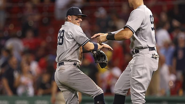 Jul 8, 2022; Boston, Massachusetts, USA; New York Yankees third baseman Josh Donaldson (28) and designated hitter Aaron Judge (99) celebrate after defeating the Boston Red Sox at Fenway Park. Mandatory Credit: Paul Rutherford-USA TODAY Sports