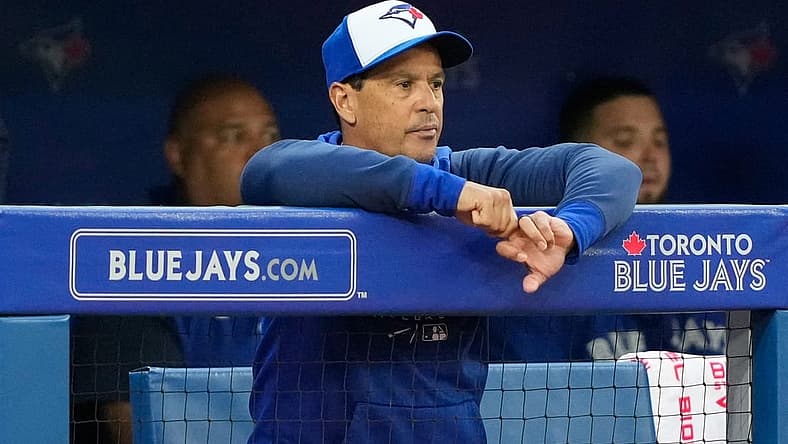 Jun 29, 2022; Toronto, Ontario, CAN; Toronto Blue Jays manager Charlie Montoyo (25) looks on from the dugout against the Boston Red Sox at Rogers Centre. Mandatory Credit: Kevin Sousa-USA TODAY Sports