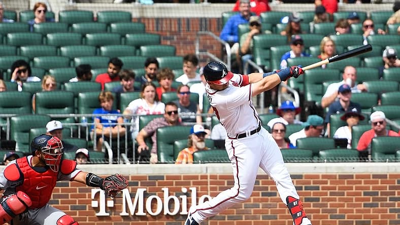Jul 9, 2022; Cumberland, Georgia, USA; Atlanta Braves third basemen Austin Riley (27) hits a home run against the Washington Nationals at Truist Park. Mandatory Credit: Larry Robinson-USA TODAY Sports