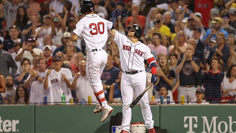 Jul 9, 2022; Boston, Massachusetts, USA; Boston Red Sox right fielder Rob Refsnyder (30) celebrates with Boston Red Sox first baseman Christian Vazquez (7) after hitting a home run during the sixth inning against the New York Yankees at Fenway Park. Mandatory Credit: Paul Rutherford-USA TODAY Sports
