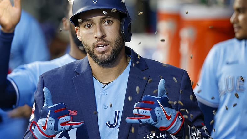Jul 9, 2022; Seattle, Washington, USA; Toronto Blue Jays center fielder George Springer (4) celebrates in the dugout after hitting a solo-home run against the Seattle Mariners during the sixth inning at T-Mobile Park. Mandatory Credit: Joe Nicholson-USA TODAY Sports