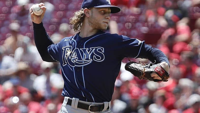 Jul 10, 2022; Cincinnati, Ohio, USA; Tampa Bay Rays starting pitcher Shane Baz (11) throws a pitch against the Cincinnati Reds during the first inning at Great American Ball Park. Mandatory Credit: David Kohl-USA TODAY Sports