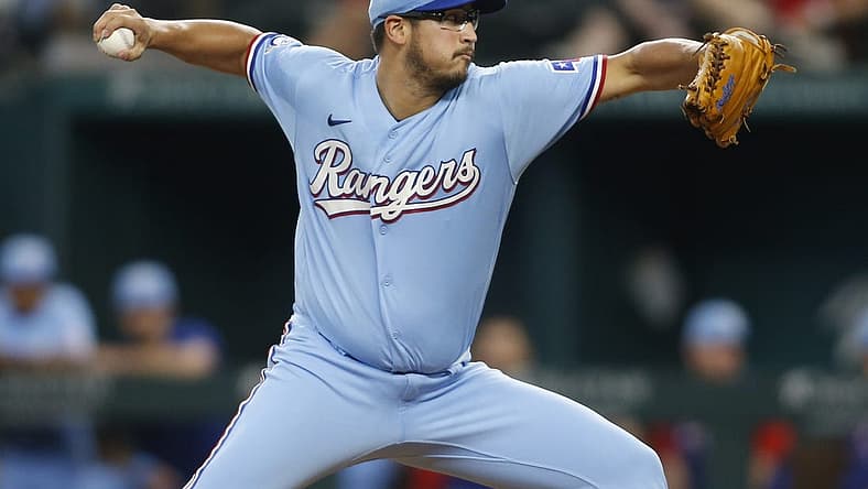 Jul 10, 2022; Arlington, Texas, USA; Texas Rangers starting pitcher Dane Dunning (33) throws a pitch against the Minnesota Twins in the first inning at Globe Life Field. Mandatory Credit: Tim Heitman-USA TODAY Sports
