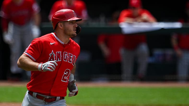 Jul 10, 2022; Baltimore, Maryland, USA;  Los Angeles Angels center fielder Mike Trout (27) runs out a eighth inning single against the Baltimore Orioles at Oriole Park at Camden Yards. Mandatory Credit: Tommy Gilligan-USA TODAY Sports