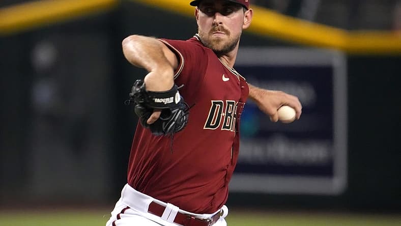 Jul 10, 2022; Phoenix, Arizona, USA; Arizona Diamondbacks starting pitcher Tyler Gilbert (49) pitches against the Colorado Rockies during the first inning at Chase Field. Mandatory Credit: Joe Camporeale-USA TODAY Sports