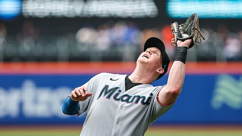 Jul 10, 2022; New York City, New York, USA; Miami Marlins first baseman Garrett Cooper (26) catches a fly ball for an out to end the sixth inning against the New York Mets at Citi Field. Mandatory Credit: Vincent Carchietta-USA TODAY Sports
