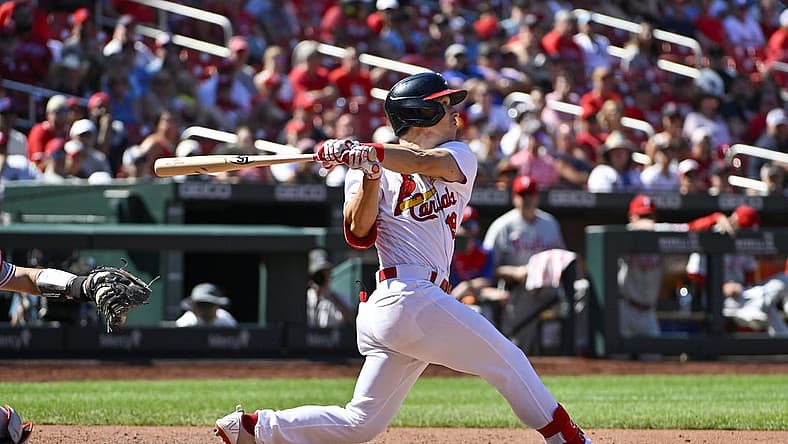 Jul 10, 2022; St. Louis, Missouri, USA; St. Louis Cardinals shortstop Tommy Edman (19) hits a one run sacrifice fly against the Philadelphia Phillies during the eighth inning at Busch Stadium. Mandatory Credit: Jeff Curry-USA TODAY Sports