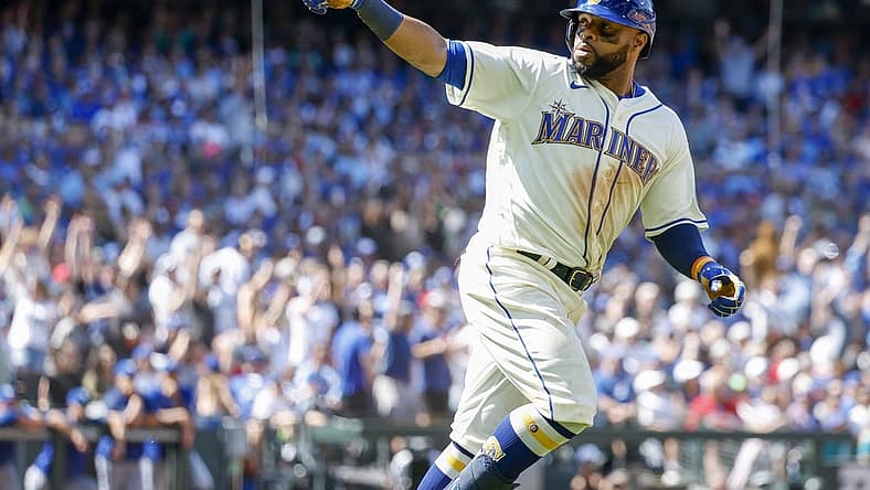 Jul 10, 2022; Seattle, Washington, USA; Seattle Mariners first baseman Carlos Santana (41) points to the dugout as he runs the bases after hitting a two-run home run against the Toronto Blue Jays during the eighth inning at T-Mobile Park. Mandatory Credit: Joe Nicholson-USA TODAY Sports