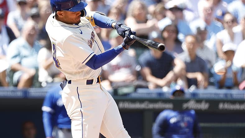 Jul 10, 2022; Seattle, Washington, USA; Seattle Mariners center fielder Julio Rodriguez hits an RBI-infield single against the Toronto Blue Jays during the fifth inning at T-Mobile Park. Mandatory Credit: Joe Nicholson-USA TODAY Sports