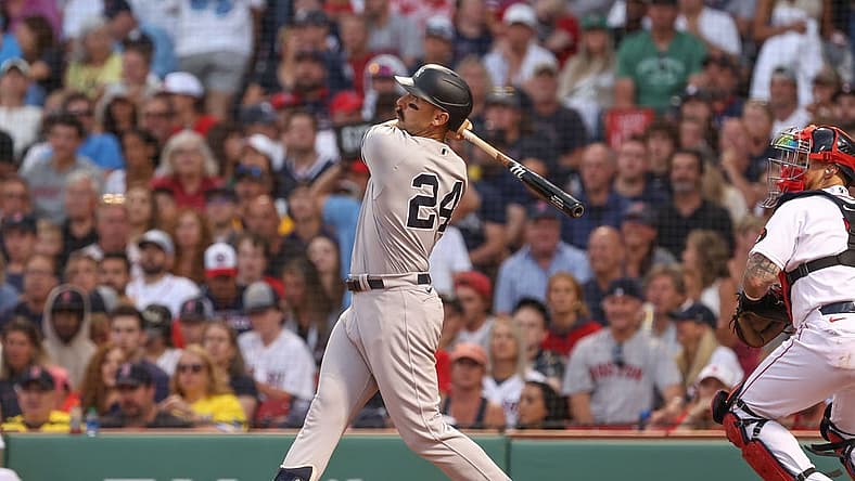 Jul 10, 2022; Boston, Massachusetts, USA; New York Yankees designated hitter Matt Carpenter (24) hits a home run during the third inning against the Boston Red Sox at Fenway Park. Mandatory Credit: Paul Rutherford-USA TODAY Sports