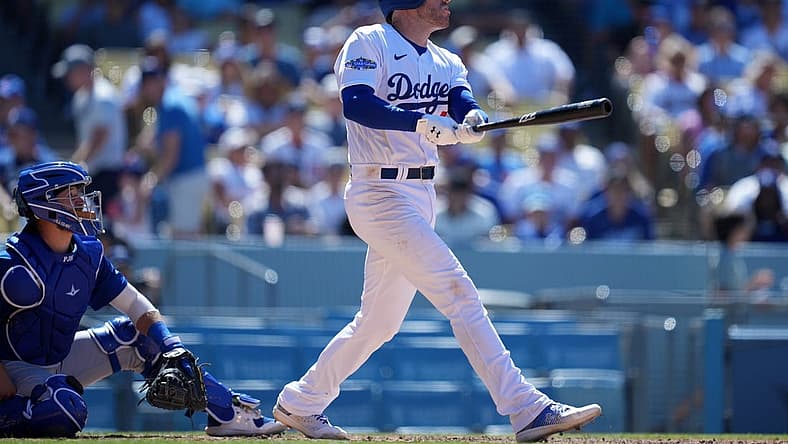 Jul 10, 2022; Los Angeles, California, USA; Los Angeles Dodgers first baseman Freddie Freeman (5) follows through on a solo home run in the sixth inning against the Chicago Cubs at Dodger Stadium. Mandatory Credit: Kirby Lee-USA TODAY Sports