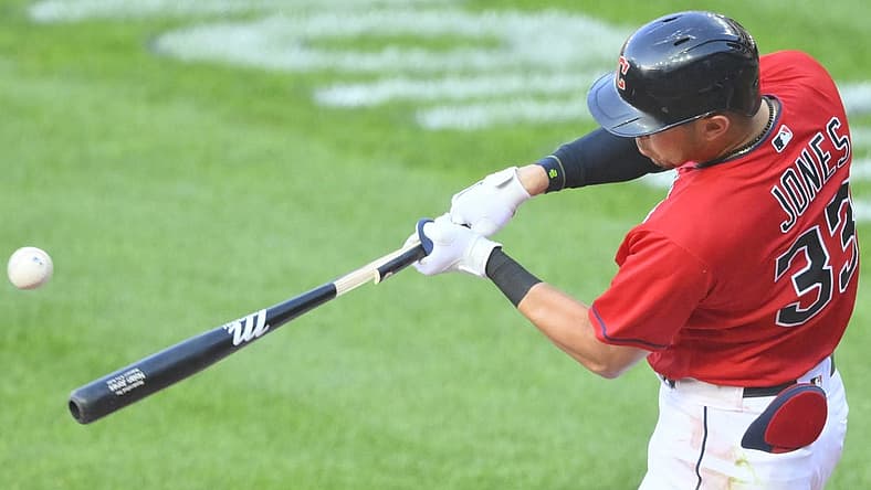 Jul 11, 2022; Cleveland, Ohio, USA; Cleveland Guardians right fielder Nolan Jones (33) hits a two-RBI single in the first inning against the Chicago White Sox at Progressive Field. Mandatory Credit: David Richard-USA TODAY Sports