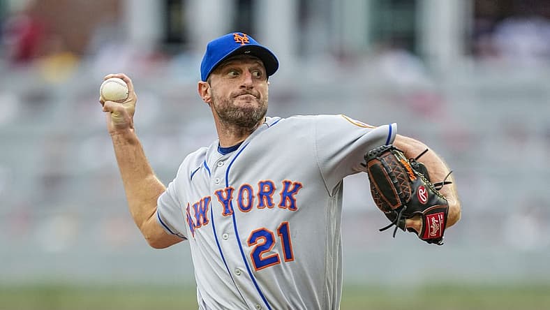 Jul 11, 2022; Cumberland, Georgia, USA; New York Mets starting pitcher Max Scherzer (21) pitches against the Atlanta Braves during the first inning at Truist Park. Mandatory Credit: Dale Zanine-USA TODAY Sports