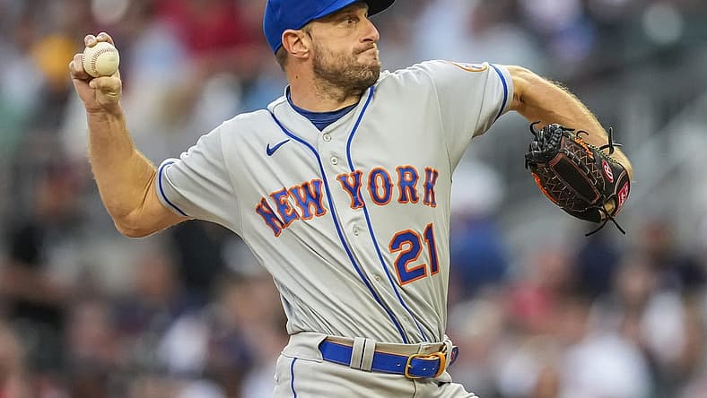 Jul 11, 2022; Cumberland, Georgia, USA; New York Mets starting pitcher Max Scherzer (21) pitches against the Atlanta Braves during the third inning at Truist Park. Mandatory Credit: Dale Zanine-USA TODAY Sports