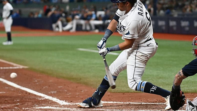 Jul 11, 2022; St. Petersburg, Florida, USA; Tampa Bay Rays second baseman Jonathan Aranda (62) hits a RBI single in the second inning against the Boston Red Sox at Tropicana Field. Mandatory Credit: Jonathan Dyer-USA TODAY Sports
