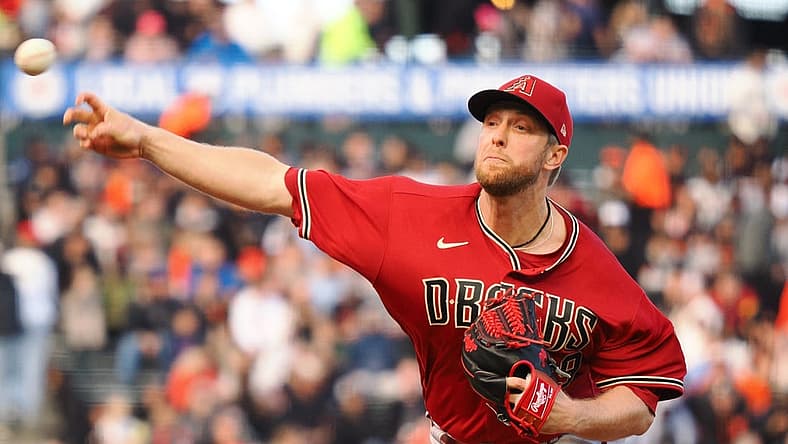 Jul 11, 2022; San Francisco, California, USA; Arizona Diamondbacks starting pitcher Merrill Kelly (29) pitches the ball against the San Francisco Giants during the first inning at Oracle Park. Mandatory Credit: Kelley L Cox-USA TODAY Sports