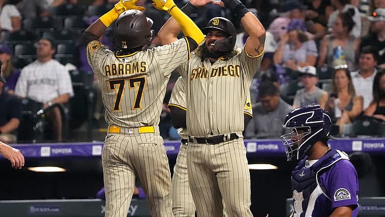 Jul 11, 2022; Denver, Colorado, USA; San Diego Padres shortstop C.J. Abrams (77) celebrates his three-run home run with catcher Jorge Alfaro (38) in the seventh inning against the Colorado Rockies at Coors Field. Mandatory Credit: Ron Chenoy-USA TODAY Sports