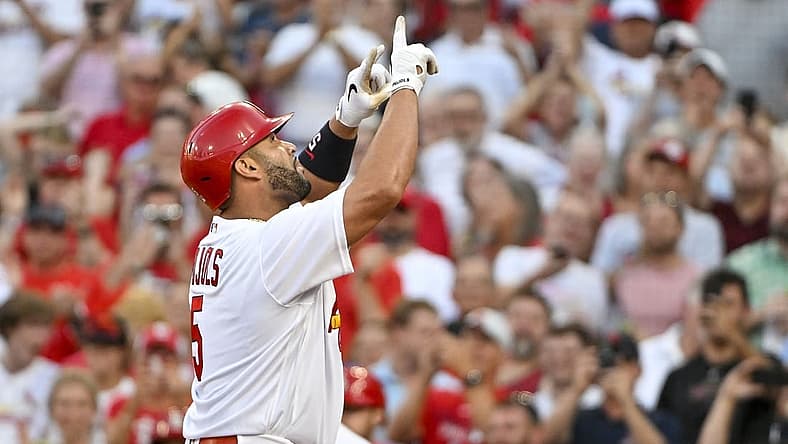 Jul 12, 2022; St. Louis, Missouri, USA; St. Louis Cardinals designated hitter Albert Pujols (5) reacts after hitting a solo home run against the Los Angeles Dodgers during the second inning at Busch Stadium. Mandatory Credit: Jeff Curry-USA TODAY Sports