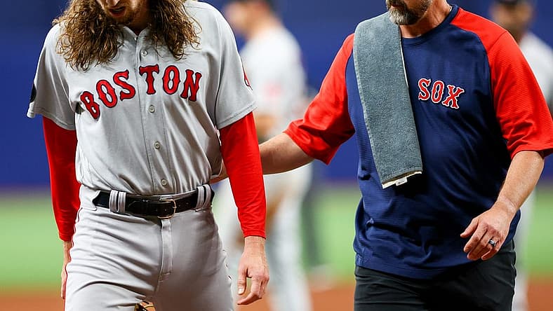 Jul 12, 2022; St. Petersburg, Florida, USA; Boston Red Sox relief pitcher Matt Strahm (left) leaves the game after getting hit by a line drive in the sixth inning against the Tampa Bay Rays at Tropicana Field. Mandatory Credit: Nathan Ray Seebeck-USA TODAY Sports
