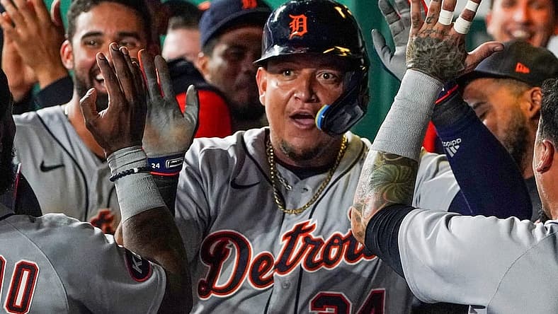 Jul 12, 2022; Kansas City, Missouri, USA; Detroit Tigers designated hitter Miguel Cabrera (24) is congratulated in the dugout against the Kansas City Royals after scoring in the seventh inning at Kauffman Stadium. Mandatory Credit: Denny Medley-USA TODAY Sports