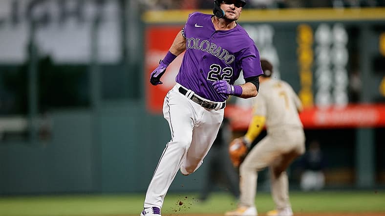 Jul 12, 2022; Denver, Colorado, USA; Colorado Rockies left fielder Sam Hilliard (22) runs to third on a fielding error from the San Diego Padres in the seventh inning at Coors Field. Mandatory Credit: Isaiah J. Downing-USA TODAY Sports