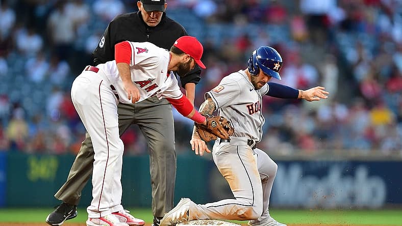 Jul 12, 2022; Anaheim, California, USA; Houston Astros designated hitter J.J. Matijevic (13) steals second against Los Angeles Angels second baseman Michael Stefanic (38) during the fourth inning at Angel Stadium. Mandatory Credit: Gary A. Vasquez-USA TODAY Sports