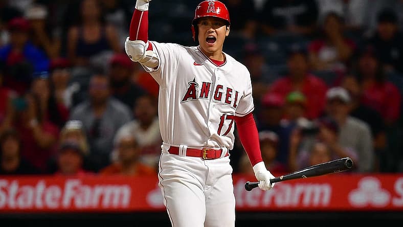Jul 12, 2022; Anaheim, California, USA; Los Angeles Angels designated hitter Shohei Ohtani (17) signals for left fielder Brandon Marsh (16) to score after Houston Astros relief pitcher Rafael Montero (47) throws a passed ball during the seventh inning at Angel Stadium. Mandatory Credit: Gary A. Vasquez-USA TODAY Sports