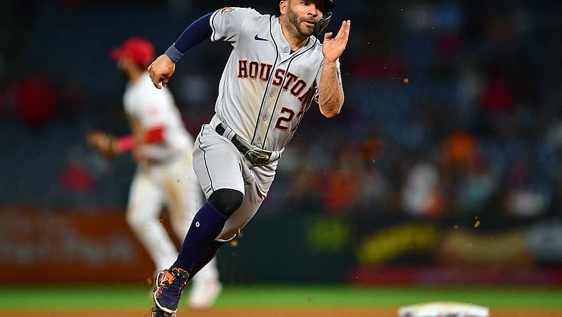 Jul 12, 2022; Anaheim, California, USA; Houston Astros second baseman Jose Altuve (27) runs to third against the Los Angeles Angels during the ninth inning at Angel Stadium. Mandatory Credit: Gary A. Vasquez-USA TODAY Sports