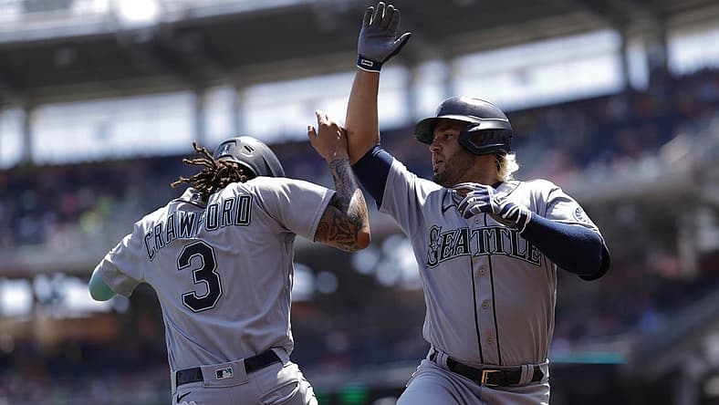 Jul 13, 2022; Washington, District of Columbia, USA; Seattle Mariners third baseman Eugenio Suarez (28) celebrates with Mariners shortstop J.P. Crawford (3) after hitting a three run home run against the Washington Nationals during the first inning at Nationals Park. Mandatory Credit: Geoff Burke-USA TODAY Sports