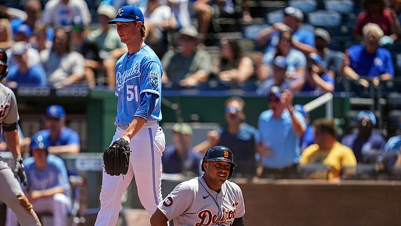 Jul 13, 2022; Kansas City, Missouri, USA; Detroit Tigers second baseman Jonathan Schoop (7) reacts after being tagged out at home plate as Kansas City Royals starting pitcher Brady Singer (51) looks on during the fourth inning at Kauffman Stadium. Mandatory Credit: Jay Biggerstaff-USA TODAY Sports
