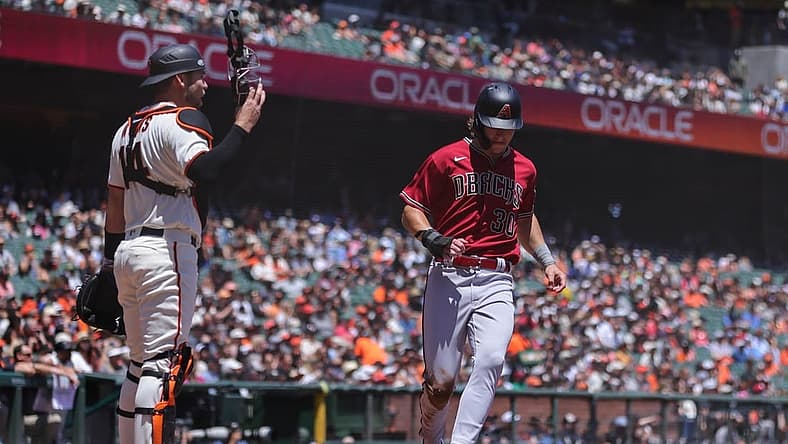 Jul 13, 2022; San Francisco, California, USA; Arizona Diamondbacks center fielder Jake McCarthy (30) scores a run during the second inning against the San Francisco Giants at Oracle Park. Mandatory Credit: Sergio Estrada-USA TODAY Sports