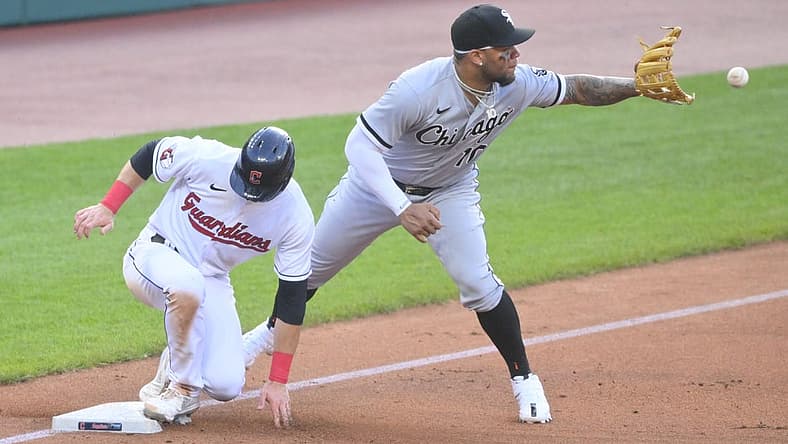 Jul 13, 2022; Cleveland, Ohio, USA; Cleveland Guardians second baseman Owen Miller (6) advances to third base beside Chicago White Sox third baseman Yoan Moncada (10) on a sacrifice fly ball in the third inning at Progressive Field. Mandatory Credit: David Richard-USA TODAY Sports