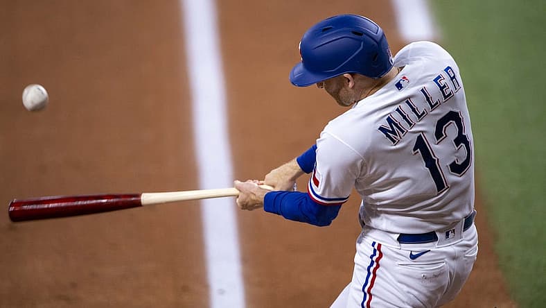 Jul 13, 2022; Arlington, Texas, USA; Texas Rangers left fielder Brad Miller (13) drives in two runs on a single against the Oakland Athletics during the first inning at Globe Life Field. Mandatory Credit: Jerome Miron-USA TODAY Sports