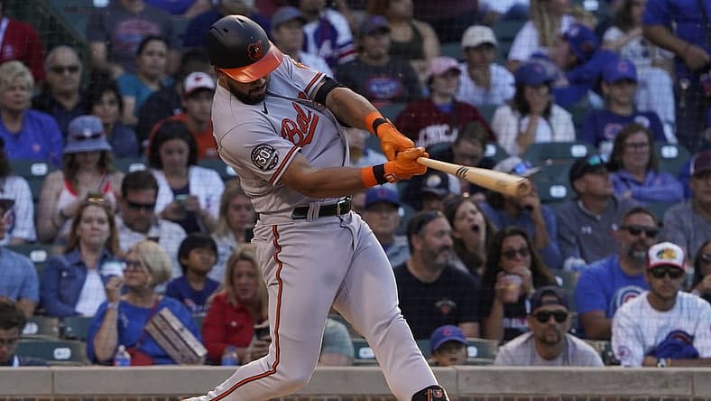 Jul 13, 2022; Chicago, Illinois, USA; Baltimore Orioles left fielder Anthony Santander (25) hits a two RBI double against the Chicago Cubs during the first inning at Wrigley Field. Mandatory Credit: David Banks-USA TODAY Sports