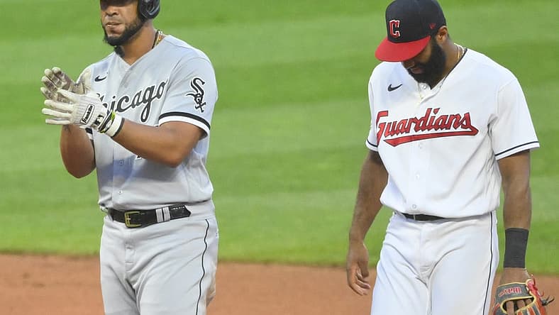 Jul 13, 2022; Cleveland, Ohio, USA; Chicago White Sox first baseman Jose Abreu (79) celebrates his RBI double beside Cleveland Guardians shortstop Amed Rosario (1) in the sixth inning at Progressive Field. Mandatory Credit: David Richard-USA TODAY Sports