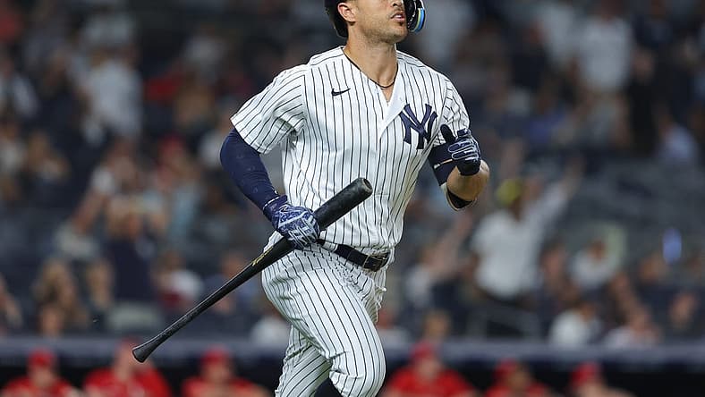 Jul 13, 2022; Bronx, New York, USA; New York Yankees right fielder Giancarlo Stanton (27) looks up at his solo home run during the eighth inning against the Cincinnati Reds at Yankee Stadium. Mandatory Credit: Vincent Carchietta-USA TODAY Sports