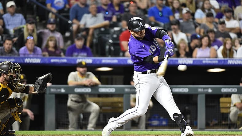 Jul 13, 2022; Denver, Colorado, USA; Colorado Rockies shortstop Jose Iglesias (11) hits a two run RBI in the seventh inning against the San Diego Padres at Coors Field. Iglesias ended the game with a 6 RBI night. Mandatory Credit: John Leyba-USA TODAY Sports