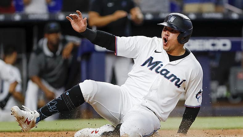 Jul 14, 2022; Miami, Florida, USA; Miami Marlins designated hitter Avisail Garcia (24) scores the winning run after a triple by third baseman Brian Anderson (not pictured) during the eleventh inning against the Pittsburgh Pirates at loanDepot Park. Mandatory Credit: Sam Navarro-USA TODAY Sports